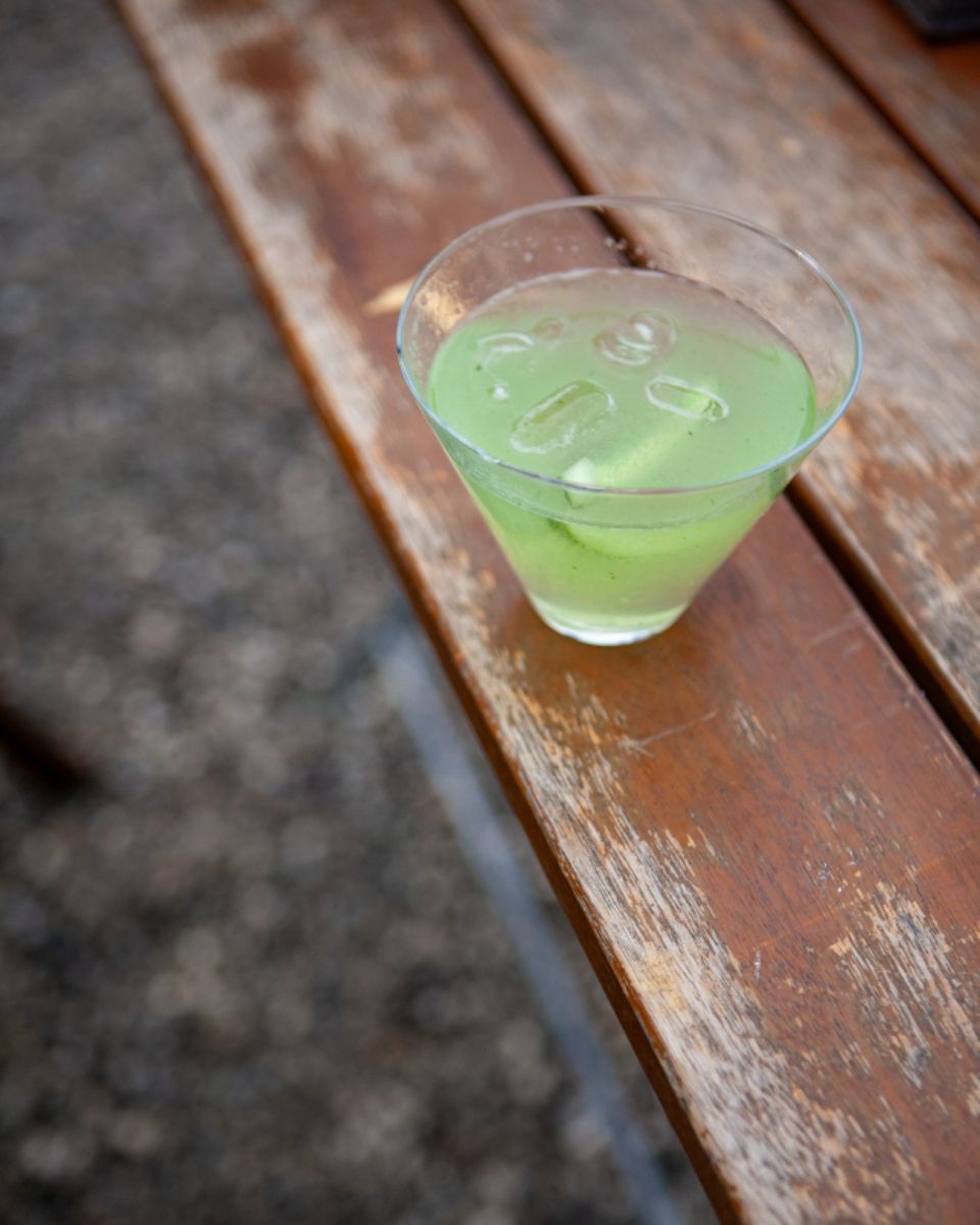 A cocktail being finished at the bar
