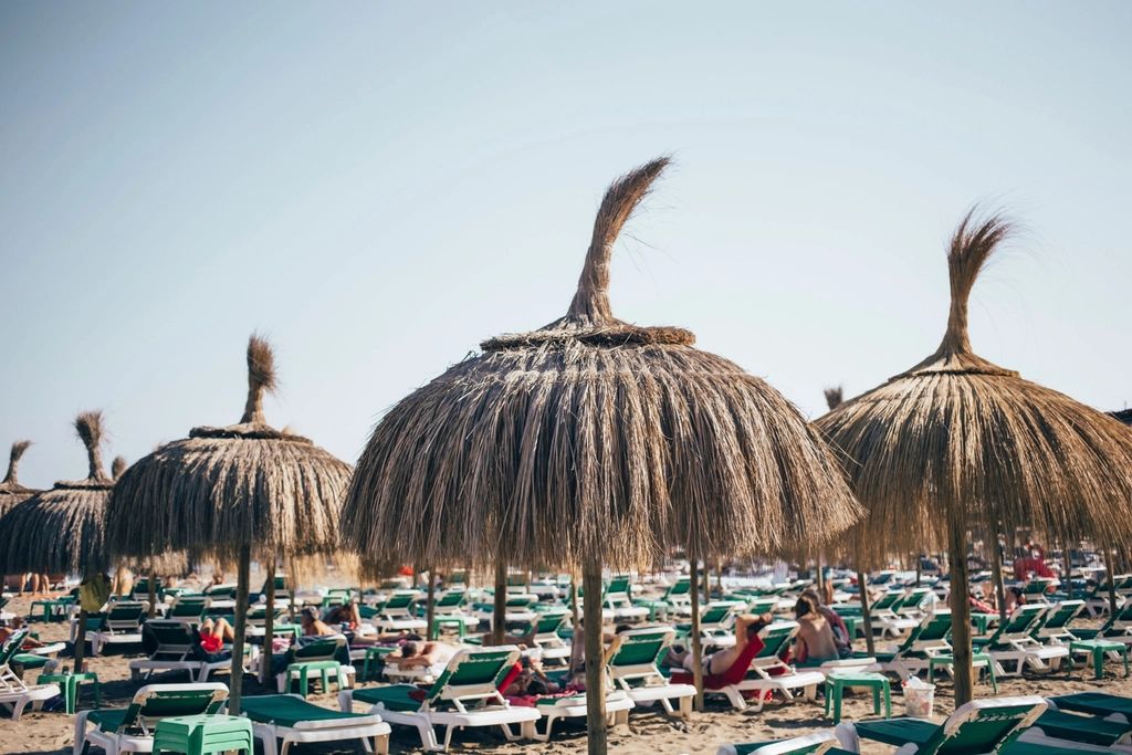 Sun loungers and a parasol beside the pool